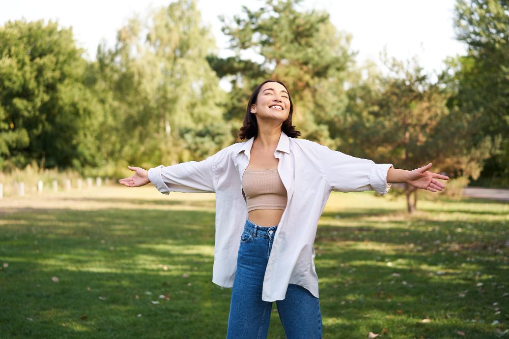 woman dancing in field
